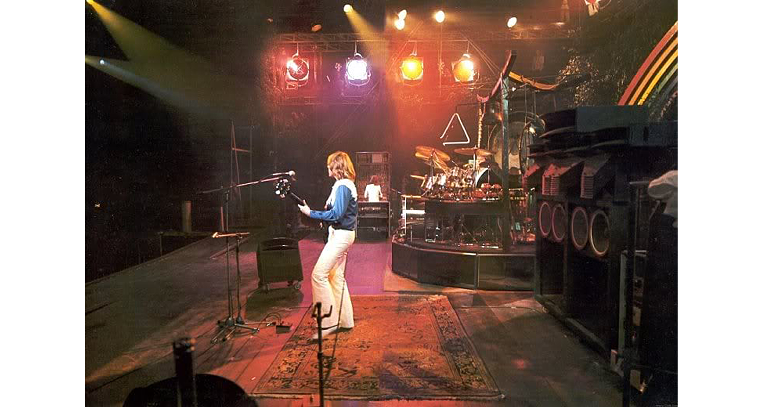 Rugs and Rockers: The Strange Bond Between Persian Rugs and Rock’n’Roll 8 Greg Lake plays with Persian rug on stage
